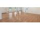 Open living room with wood floors and natural light from the home's front windows at 1051 Rock Springs Rd, Lawrenceville, GA 30043