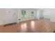 Inviting living room featuring hardwood floors, white trim, and an open layout at 1051 Rock Springs Rd, Lawrenceville, GA 30043
