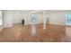 Bright and airy living room with hardwood floors and seamless flow into dining and kitchen areas at 1051 Rock Springs Rd, Lawrenceville, GA 30043