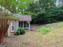 Home's back has a deck and wooded view at 175 Abner Dr, Mcdonough, GA 30252