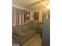 Cozy living room with a comfortable sofa, speakers, and wall paneling at 212 Little St, Atlanta, GA 30315