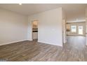 Open concept living room with hardwood floors and natural light at 1613 Fuma Leaf Way # 273, Mcdonough, GA 30253