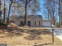 Single-story home with gray siding, driveway and an attached one-car garage at 110 Peridot Pl, South Fulton, GA 30349