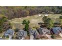 An aerial view of the house from above the golf course, highlighting its picturesque setting at 269 Legends Trce, Mcdonough, GA 30253