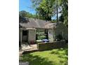 Backyard view of a cozy home featuring a small patio area, perfect for outdoor relaxation at 544 Westmeath Sw Dr, Atlanta, GA 30310