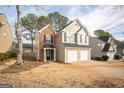 Two-story house with brick and siding exterior, two-car garage, and landscaping at 4248 Brighton Nw Way, Kennesaw, GA 30144