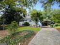 Charming single-story home with a lovely front yard and a covered carport at 2606 Ramblewood Ct, Acworth, GA 30102