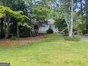 Charming single-story home with a lovely front yard and a covered carport at 2606 Ramblewood Ct, Acworth, GA 30102