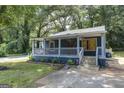 Charming blue house with a covered porch and well-manicured lawn at 106 Hillside Se Ave, Atlanta, GA 30315