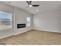 This spacious living room includes a modern fireplace and plenty of natural light at 271 Orwell Dr # 49, Social Circle, GA 30025