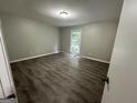 Spacious bedroom with light gray walls and wood-look flooring at 2961 Forelock Sw Pl, Marietta, GA 30064