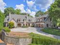 Stone house with circular driveway and three-car garage at 2554 Emerald Dr, Jonesboro, GA 30236