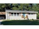 Charming single-story home with a well-manicured lawn and inviting blue front door at 749 Casplan Sw St, Atlanta, GA 30310