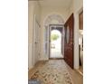 Inviting entryway with decorative rug and arched doorway at 121 Pinnacle Ln, Mcdonough, GA 30253