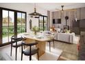 Inviting dining and living space with wood accents, modern furnishings, and ample natural light at 17 Cheney St, East Point, GA 30344