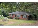 Brick ranch house with tree-lined yard at 770 Bridgewater Street Southwest W St, Atlanta, GA 30310