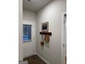 Inviting entryway with coat rack, decorative art, and door with window at 253 Ivey Ter # 48, Temple, GA 30179