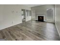 Spacious living room featuring hardwood floors and a fireplace at 6235 Marbut Farms Trl, Lithonia, GA 30058