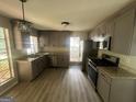 Modern kitchen with granite counters and stainless steel appliances at 435 Ridgedale Way, Lawrenceville, GA 30044