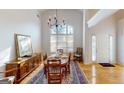 Dining room with cathedral ceiling, lots of natural light, and chandelier at 1461 Hada Ln, Lawrenceville, GA 30043