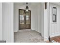 Double front doors with glass panels and brick flooring at 150 Dockside Dr # 382, Fayetteville, GA 30215