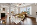 Sunlit living room with hardwood floors and access to the patio at 4983 Whiteoak Se Walk # Bldg 19, Smyrna, GA 30080