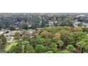 Aerial view of a lush, established neighborhood filled with mature trees and well-maintained homes at 470 Dix Lee On Dr, Fayetteville, GA 30214