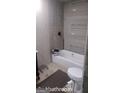 Unfinished bathroom with bathtub, toilet, and shower components at 4571 Scarborough Rd, South Fulton, GA 30349