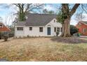 Charming, cottage-style home featuring a newly painted exterior, landscaped yard, and mature shade trees at 2013 Marco Dr, Decatur, GA 30032