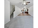 Open concept living room and kitchen space with gray carpet and wood flooring at 4001 Avalon Sw Rd, Atlanta, GA 30331