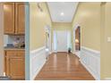 Elegant foyer with gleaming wood floors and classic white trim at 4424 Bellwood Cir, Atlanta, GA 30349