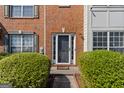 Charming brick facade with a welcoming front door, complemented by manicured shrubbery at 2783 Parkway Cv, Lithonia, GA 30058