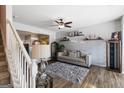 Inviting living room with a ceiling fan, a comfortable sofa, and stylish decor at 2783 Parkway Cv, Lithonia, GA 30058