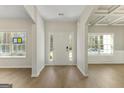 Bright foyer with hardwood floors, decorative trim, and views into adjacent living spaces at 515 Bohannon Rd # 13, Grantville, GA 30220