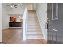 Inviting foyer with stairway and tile flooring, creating a warm and spacious entrance at 516 Jaclyn Cir, Mcdonough, GA 30253