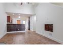 Open concept living area featuring tile flooring, bar seating, and seamless flow to kitchen at 516 Jaclyn Cir, Mcdonough, GA 30253