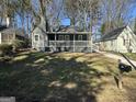 Charming home with a inviting front porch, lush green lawn and mature trees at 1457 Richland Sw Rd, Atlanta, GA 30310