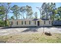 Ranch style home with a spacious yard and mature trees at 1092 W Adrian Sw Cir, Conyers, GA 30094