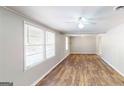 Bright living room with hardwood floors and neutral walls at 1092 W Adrian Sw Cir, Conyers, GA 30094