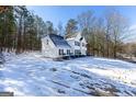 Two-story house with attached garage and snow-covered yard at 22 Agean Way, Whitesburg, GA 30185