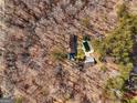 House with pool, viewed from above in a wooded area at 785 Seabolt Rd, Locust Grove, GA 30248