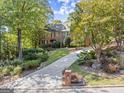 Long driveway approach to a beautiful traditional brick home at 7300 Chattahoochee Bluff Dr, Sandy Springs, GA 30350