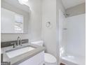 Clean bathroom featuring a modern vanity, a frameless mirror, and a walk-in shower with white tiled walls at 4239 Newcomb Rd, Decatur, GA 30034