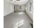 Spacious living area with ample natural light and neutral carpeting at 828 Pinevalley Dr, Forest Park, GA 30297