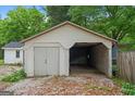 The garage is spacious, featuring one enclosed bay and one open bay at 734 W College St, Bowdon, GA 30108