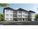 Inviting three story condo building featuring balconies, brick accents and mature landscaping at 1000 Blair Ln # 102, Peachtree City, GA 30269