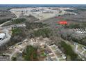 Expansive aerial view of the property, showcasing its location near Highway 19/41 and surrounding community at 130 Nicki Ct, Hampton, GA 30228