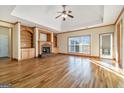 Spacious living room boasts hardwood floors, a fireplace, and built-in shelving at 625 Aya Cir, Loganville, GA 30052