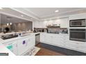 Bright kitchen features stainless steel appliances and white cabinets at 6 Alston Ne Pl, Atlanta, GA 30324