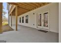 Covered patio with concrete flooring and exposed ceiling at 5480 Two Hills Dr # 31, Fairburn, GA 30213